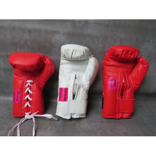 321 - THREE SIGNED BOXING GLOVES, to include Lennox Lewis, Frank Bruno and Johnny Nelson