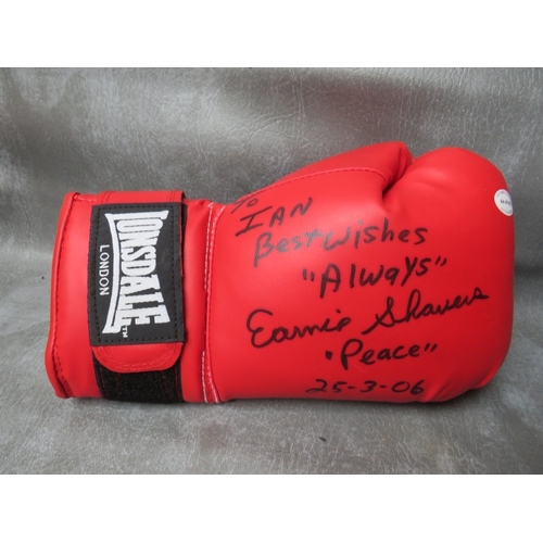 325 - FOUR SIGNED BOXING GLOVES, to include Leon Spinks, Evander Holyfield, Ernie Shavers and Thomas Hearn... 