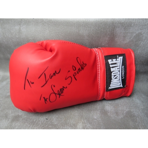 325 - FOUR SIGNED BOXING GLOVES, to include Leon Spinks, Evander Holyfield, Ernie Shavers and Thomas Hearn... 