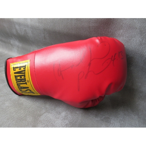 325 - FOUR SIGNED BOXING GLOVES, to include Leon Spinks, Evander Holyfield, Ernie Shavers and Thomas Hearn... 