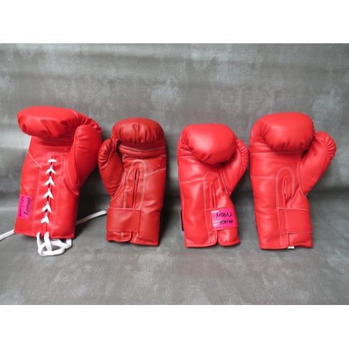 326 - FOUR SIGNED BOXING GLOVES, to include Tim Witherspoon, James Bonecrusher Smith, Mike Tyson and Danny... 