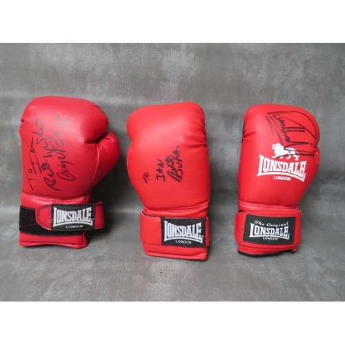 327 - THREE SIGNED BOXING GLOVES, to include Richie Woodhall, Nigel Benn and Roberto Duran