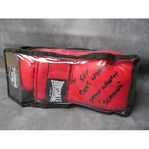 328 - SEVEN SIGNED BOXING GLOVES, to include Rubin Hurricane Carter, Shaun Walton etc