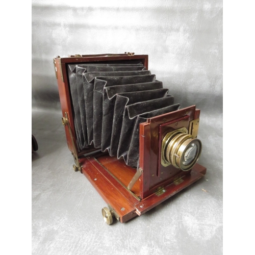 497 - TWO LATE 19TH CENTURY PLATE CAMERAS, to include a large 10