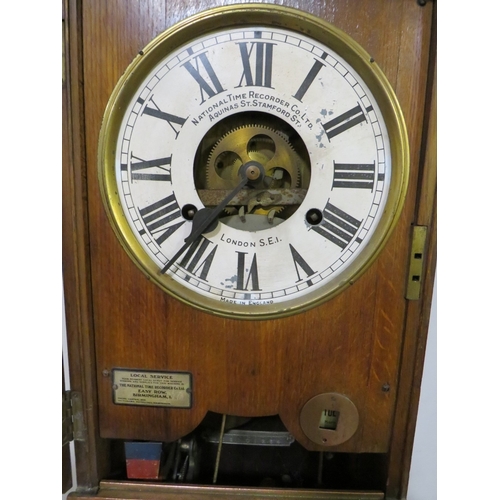 501 - A NATIONAL TIME RECORDER OAK CASED CLOCKING IN CLOCK, with visible clock movement, H 88 cm