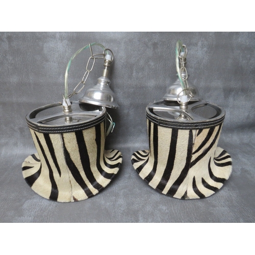 508 - A SET OF FOUR UNUSUAL DESIGNER ZEBRA PATTERN TOP HAT PENDANT LIGHTS, in chrome and faux zebra fur