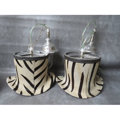 508 - A SET OF FOUR UNUSUAL DESIGNER ZEBRA PATTERN TOP HAT PENDANT LIGHTS, in chrome and faux zebra fur