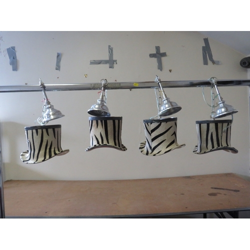 508 - A SET OF FOUR UNUSUAL DESIGNER ZEBRA PATTERN TOP HAT PENDANT LIGHTS, in chrome and faux zebra fur