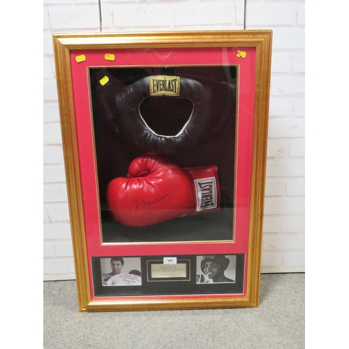 309 - A FRAMED MUHAMMAD ALI BOXING GLOVE AND HEADGUARD, both items signed