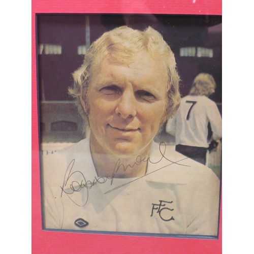 329 - A FRAMED 1966 ENGLAND FOOTBALL WORLD CUP WINNING PICTURE OF BOBBY MOORE, signed along with all ten o... 