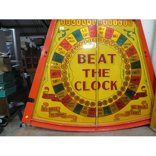 565 - A MID 20TH CENTURY PAINTED WOOD FAIRGROUND ROLL A BALL GAME BOARD, mainly in red and yellow, 144 cm ... 