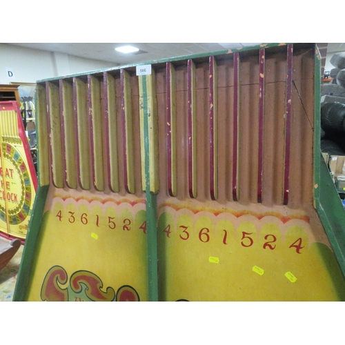 566 - A MID 20TH CENTURY PAINTED WOOD FAIRGROUND ROLL A BALL GAME BOARD, mainly in green and yellow, 145 c... 