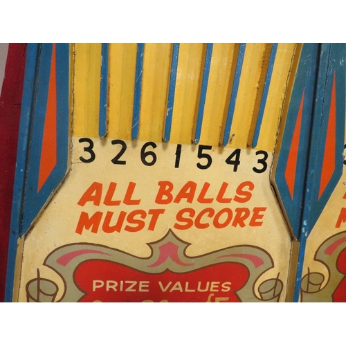 567 - A MID 20TH CENTURY PAINTED WOOD FAIRGROUND ROLL A BALL GAME BOARD, mainly in red, yellow and blue, 1... 