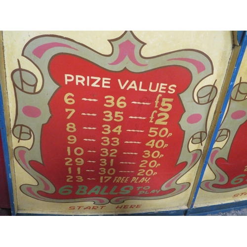 567 - A MID 20TH CENTURY PAINTED WOOD FAIRGROUND ROLL A BALL GAME BOARD, mainly in red, yellow and blue, 1... 