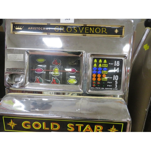 549 - A VINTAGE ARISTOCRAT GROSVENOR ONE ARMED BANDIT, gold star machine with origianl foot board, H 144 c... 