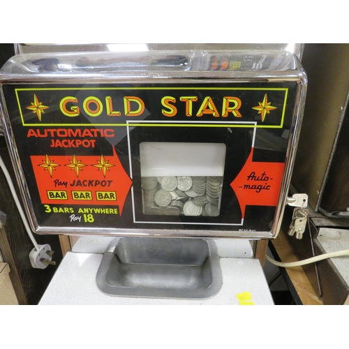 549 - A VINTAGE ARISTOCRAT GROSVENOR ONE ARMED BANDIT, gold star machine with origianl foot board, H 144 c... 