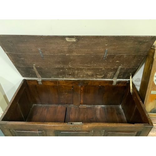 702 - An antique oak mule chest with two drawers below, W 120 cm