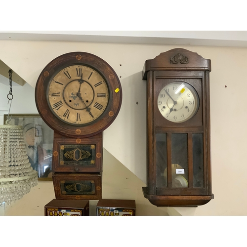 709 - An antique American inlaid wall clock together with an Edwardian oak placed wall clock, both as foun... 