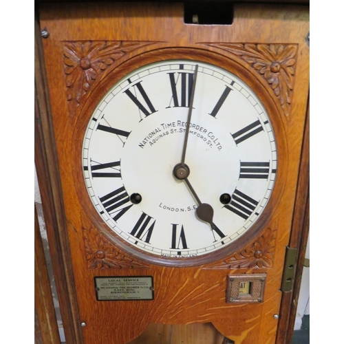 708 - A WALL MOUNTED NATIONAL TIME RECORDER OAK CASED CLOCKING IN CLOCK, H 119 cm