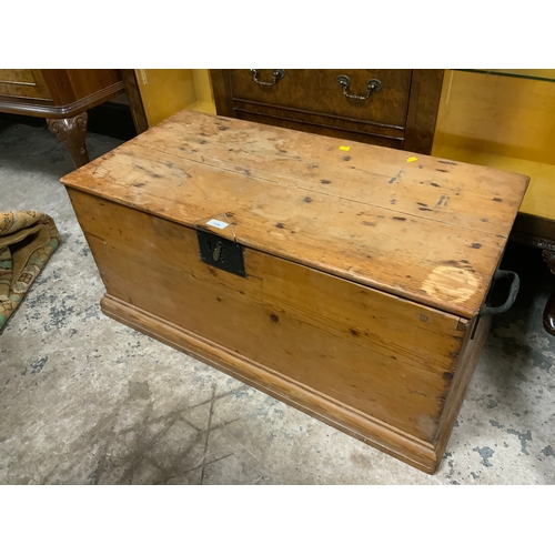 724 - An antique pine, twin handle blanket box with repairs W 97 cm