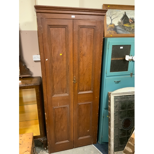 726 - A vintage tall, two door 19th century school style cupboard H 212 cm