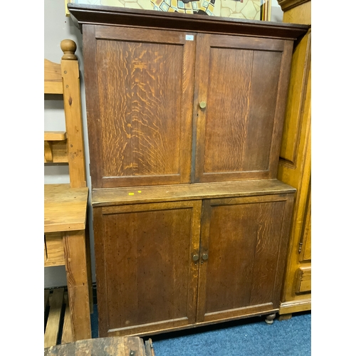 736 - An antique oak school type cupboard with two door, cupboard above and below H 175 cm W 119 cm