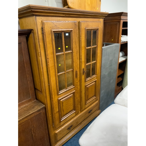 737 - A 20th century, heavy oak glazed display cupboard with single drawer below H 195 cm W 132 cm