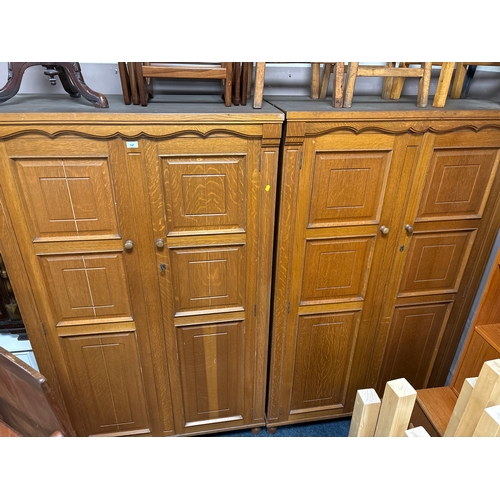 747 - A pair of modern heavy oak two door wardrobes / bookcases