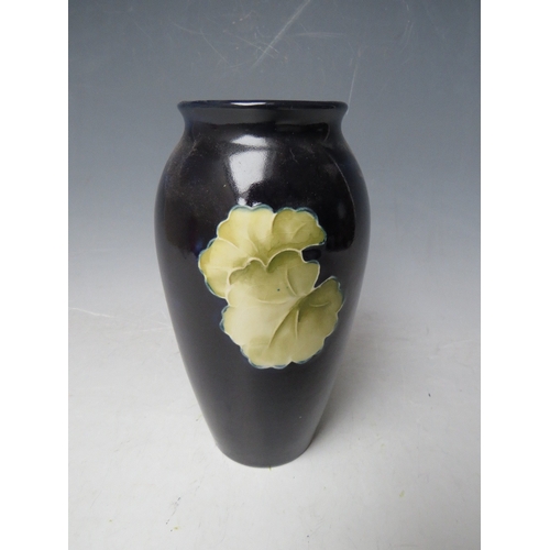 304 - A MOORCROFT FLORAL PATTERN BALUSTER VASE, H 19 cm