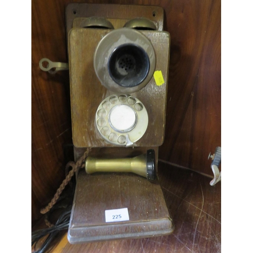 225 - A VINTAGE WALL MOUNTED STICK TELEPHONE