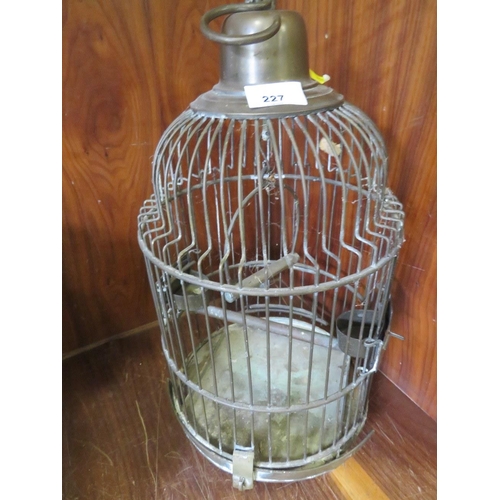 227 - A VINTAGE BRASS BIRDCAGE