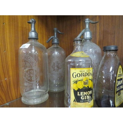 232 - A COLLECTION OF VINTAGE BOTTLES TO INCLUDE A CATER MINERAL WATER OF OSWESTRY SODA SYPHON