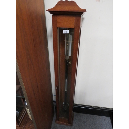 242 - A WOODEN CASED BAROMETER WITH KEY