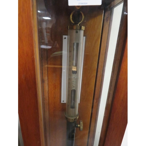 242 - A WOODEN CASED BAROMETER WITH KEY