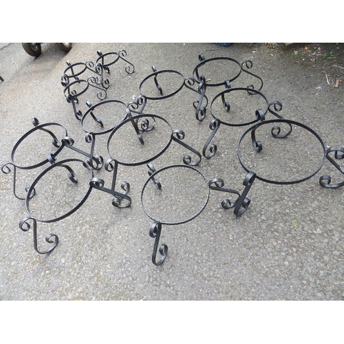 610 - A SELECTION OF TWELVE STEEL GARDEN PLANTER STANDS