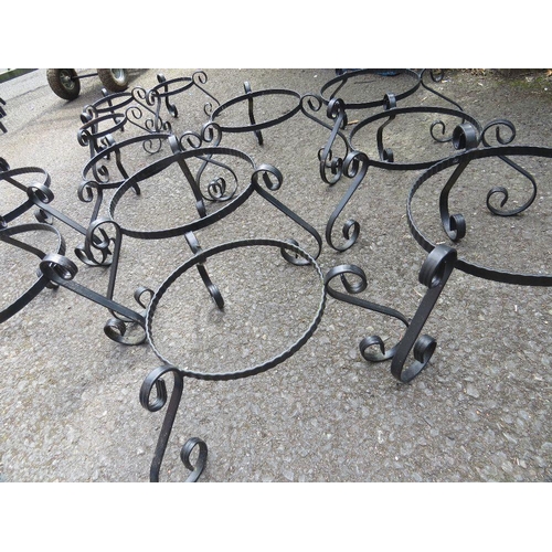 610 - A SELECTION OF TWELVE STEEL GARDEN PLANTER STANDS