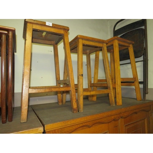 750 - Three mid century wooden stools together with an industrial folding style chair