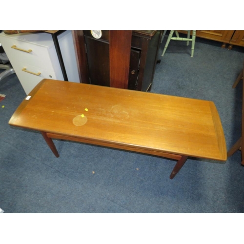 751 - A teak mid-century coffee table with staining to the top