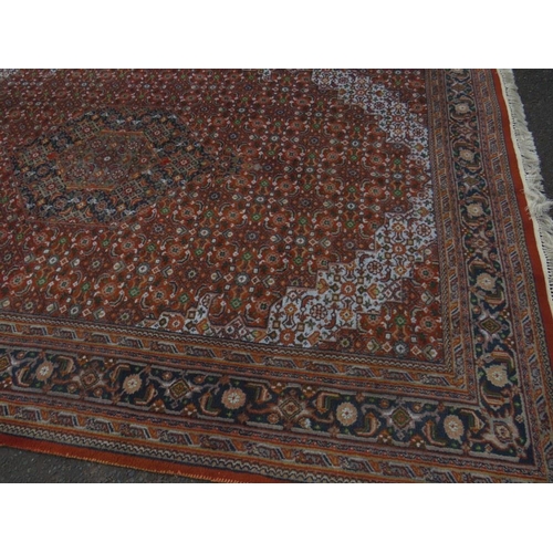 757 - A large Eastern woollen rug together with a smaller modern woollen rug