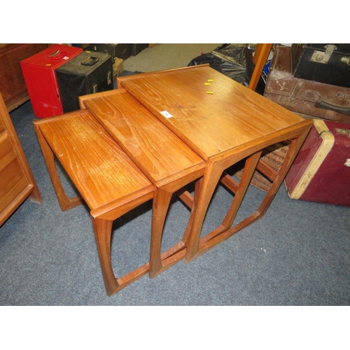 760 - A nest of mid-century teak tables with marked top