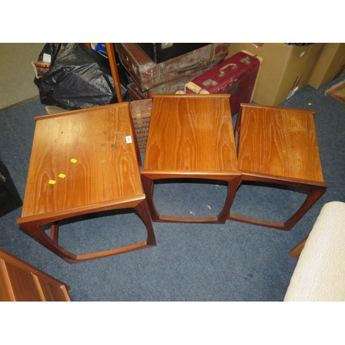 760 - A nest of mid-century teak tables with marked top