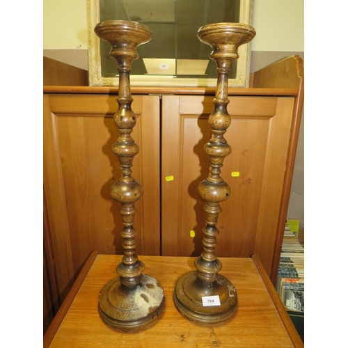 764 - A pair of late 19th century turned oak candlesticks