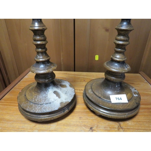 764 - A pair of late 19th century turned oak candlesticks