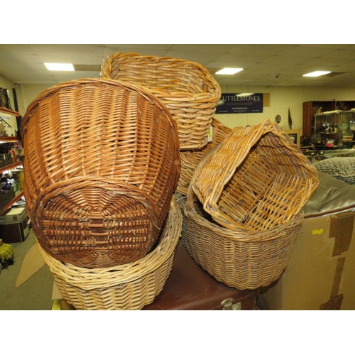 765 - A large collection of vintage suitcases, wicker hampers and baskets