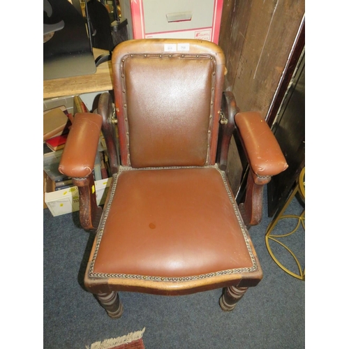 768 - A LATE VICTORIAN BARBERS / DENTISTS CHAIR, with upholstered mahogany frame, with reclining back rest... 