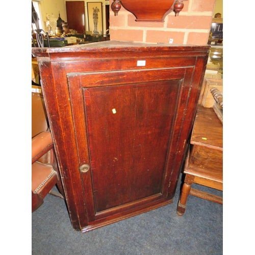 770 - A Georgian oak panelled hanging corner cupboard