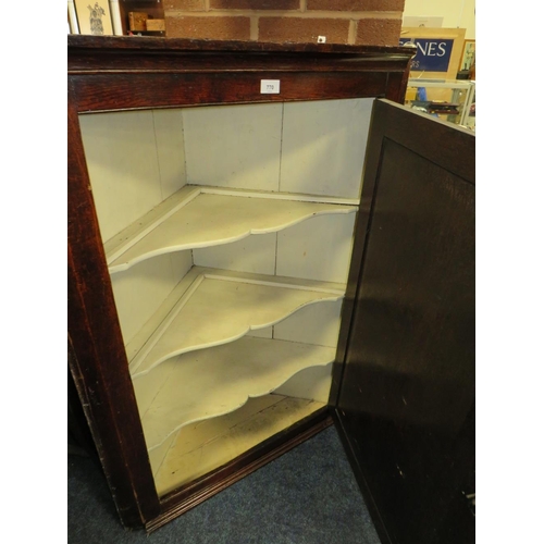 770 - A Georgian oak panelled hanging corner cupboard