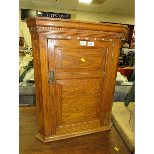 772 - AN ANTIQUE OAK HANGING CORNER CUPBOARD WITH MOTHER-OF-PEARL INLAY