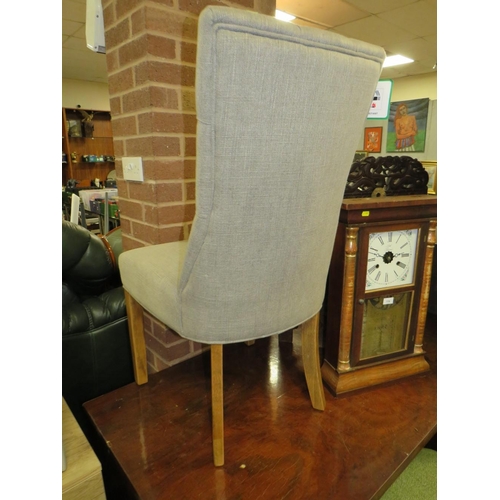 777 - A modern grey upholstered button backed dining chair