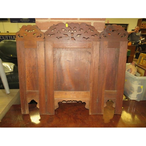 779 - A carved Eastern hardwood fire screen with dragon detail